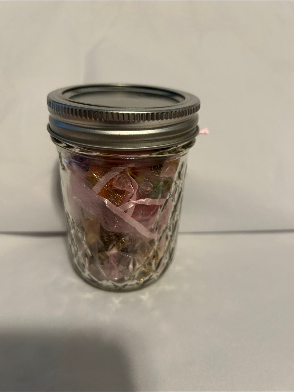 Multiples Pink and Gold Jewelry in Glass Jar